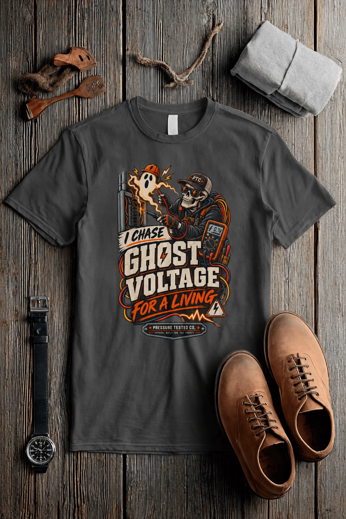 Ghost Voltage T-Shirt — 'I Chase Ghost Voltage for a Living' Vintage Electrician Tee — pepper t-shirt, flat-lay product photo | Pressure Tested Co