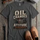 'Oil Changes and Attitude Adjustments' T-Shirt — Funny Retro Industrial Mechanic's Tee — pepper t-shirt, flat-lay product photo | Pressure Tested Co