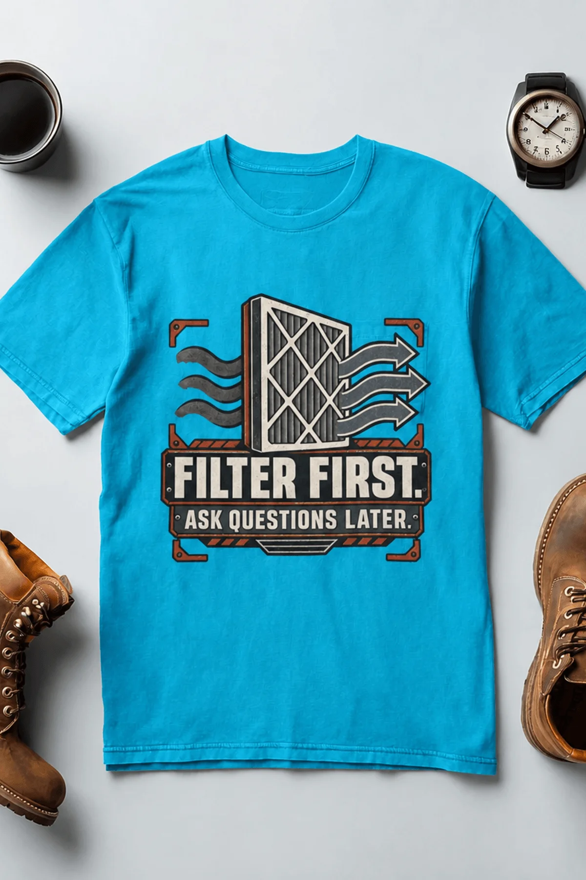 T-Shirt — "Filter First. Ask Questions Later." HVAC Air Filter Graphic — sapphire t-shirt, flat-lay product photo | Pressure Tested Co