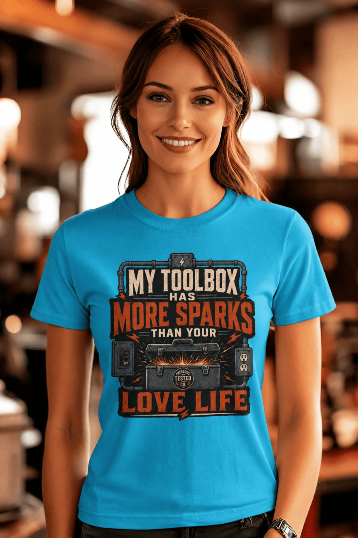 T-Shirt — "My Toolbox Has More Sparks Than Your Love Life" Electrician/Mechanic Workshop Tee — sapphire t-shirt, model photo | Pressure Tested Co
