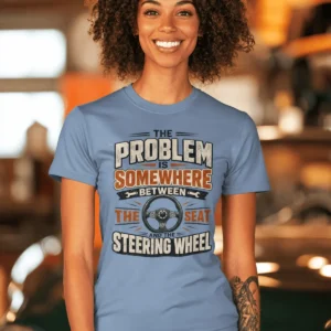 Driving Humor T-Shirt — "The Problem Is Somewhere Between The Seat And The Steering Wheel" — steel-blue t-shirt, model photo | Pressure Tested Co