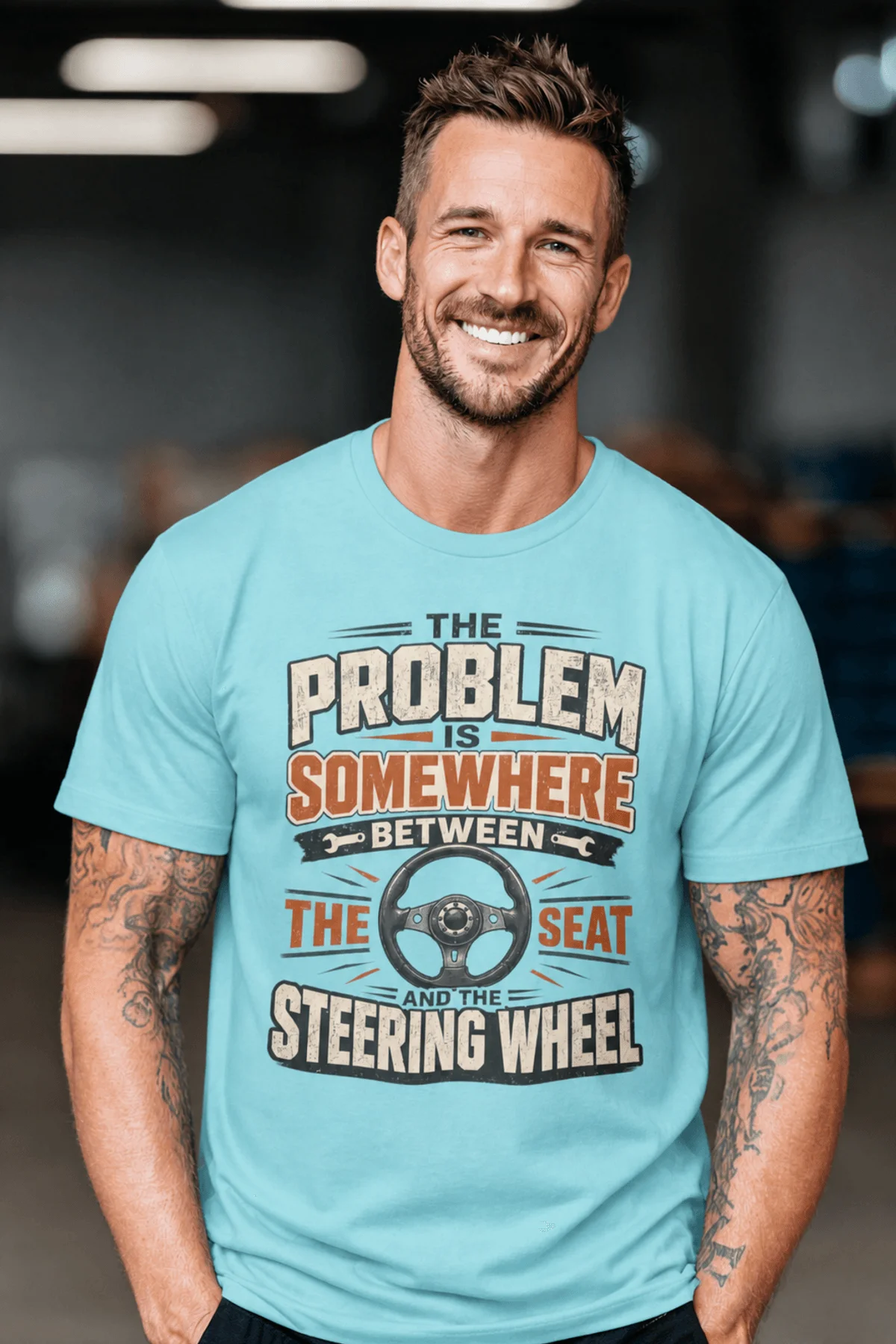 Driving Humor T-Shirt — "The Problem Is Somewhere Between The Seat And The Steering Wheel" — turquoise t-shirt, model photo | Pressure Tested Co