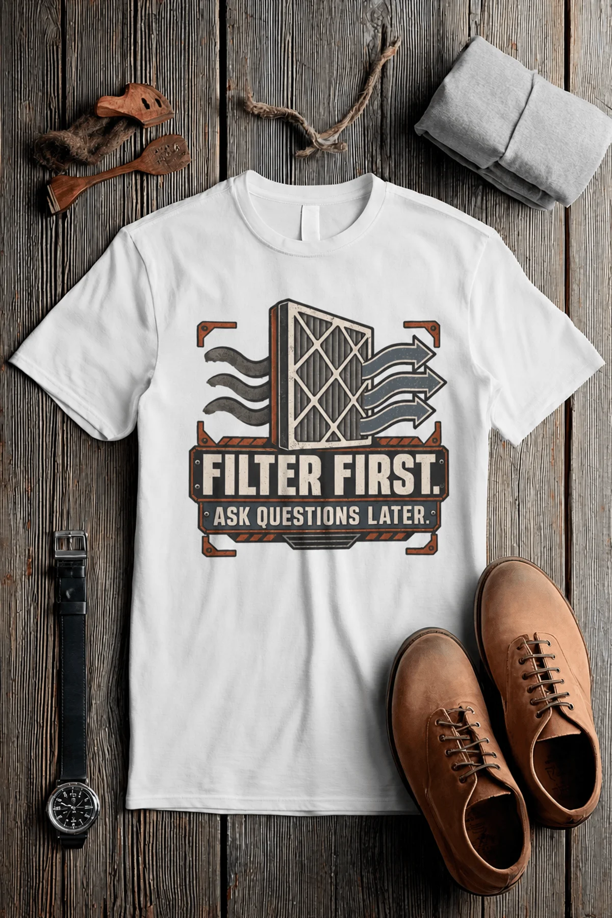 T-Shirt — "Filter First. Ask Questions Later." HVAC Air Filter Graphic — white t-shirt, flat-lay product photo | Pressure Tested Co