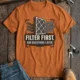 T-Shirt — "Filter First. Ask Questions Later." HVAC Air Filter Graphic — yam t-shirt, flat-lay product photo | Pressure Tested Co