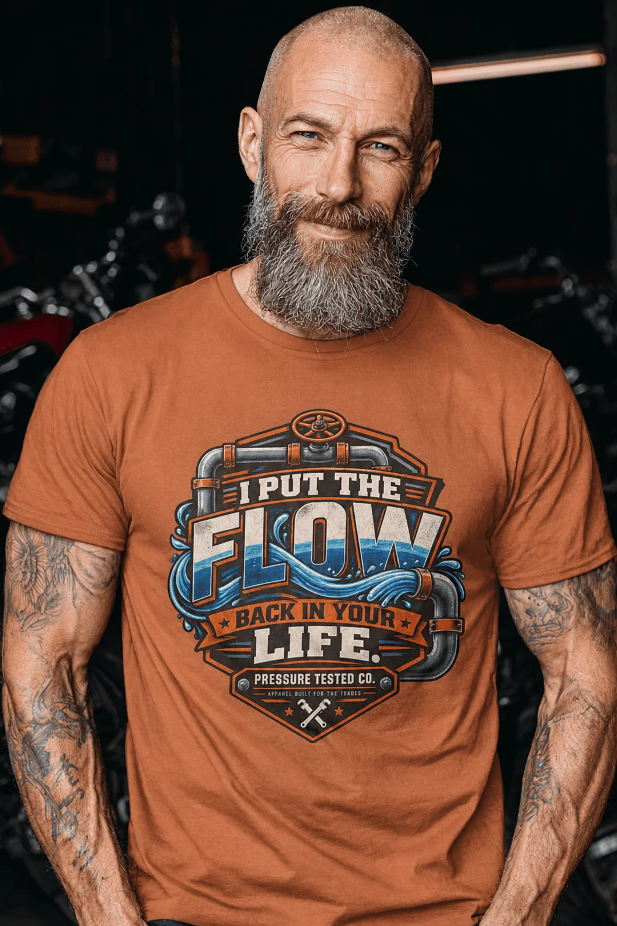 'I Put The Flow Back Into Your Life.' T-Shirt — Funny Retro Industrial Plumber's Tee — yam t-shirt, model photo | Pressure Tested Co