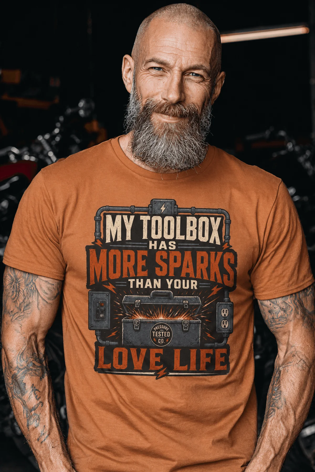 T-Shirt — "My Toolbox Has More Sparks Than Your Love Life" Electrician/Mechanic Workshop Tee — yam t-shirt, model photo | Pressure Tested Co