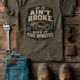 T-Shirt — "If It Ain't Broke, Give It Five Minutes" Vintage Mechanic Tee — army t-shirt, flat-lay product photo | Pressure Tested Co