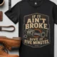 T-Shirt — "If It Ain't Broke, Give It Five Minutes" Vintage Mechanic Tee — black t-shirt, flat-lay product photo | Pressure Tested Co