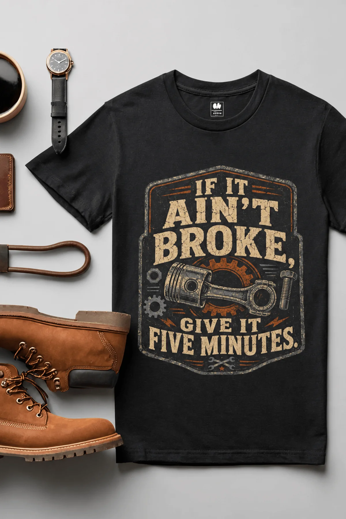 T-Shirt — "If It Ain't Broke, Give It Five Minutes" Vintage Mechanic Tee — black t-shirt, flat-lay product photo | Pressure Tested Co