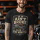 T-Shirt — "If It Ain't Broke, Give It Five Minutes" Vintage Mechanic Tee — black t-shirt, model photo | Pressure Tested Co