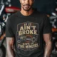 T-Shirt — "If It Ain't Broke, Give It Five Minutes" Vintage Mechanic Tee — dark-grey-heather t-shirt, model photo | Pressure Tested Co