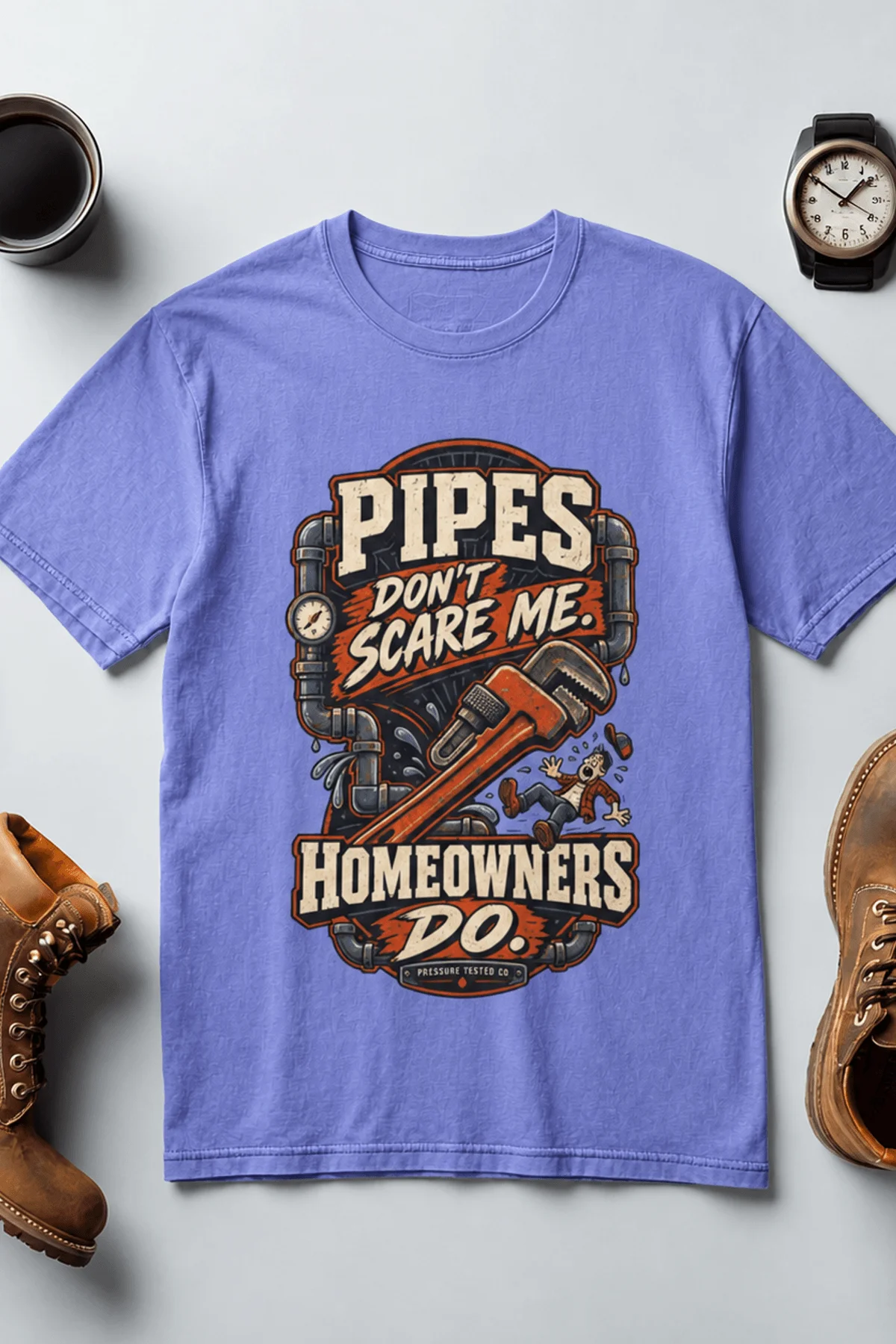 Plumber Humor T-Shirt — “Pipes Don't Scare Me, Homeowners Do” Graphic Pipe Tee — flo-blue t-shirt, flat-lay product photo | Pressure Tested Co