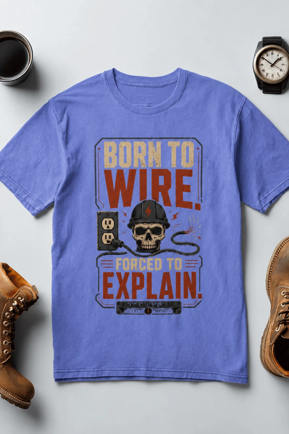 Electrician T-Shirt — "Born to Wire, Forced to Explain" Vintage Skull Tee — flo-blue t-shirt, flat-lay product photo | Pressure Tested Co