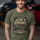 T-Shirt — "If It Ain't Broke, Give It Five Minutes" Vintage Mechanic Tee — military-green t-shirt, model photo | Pressure Tested Co