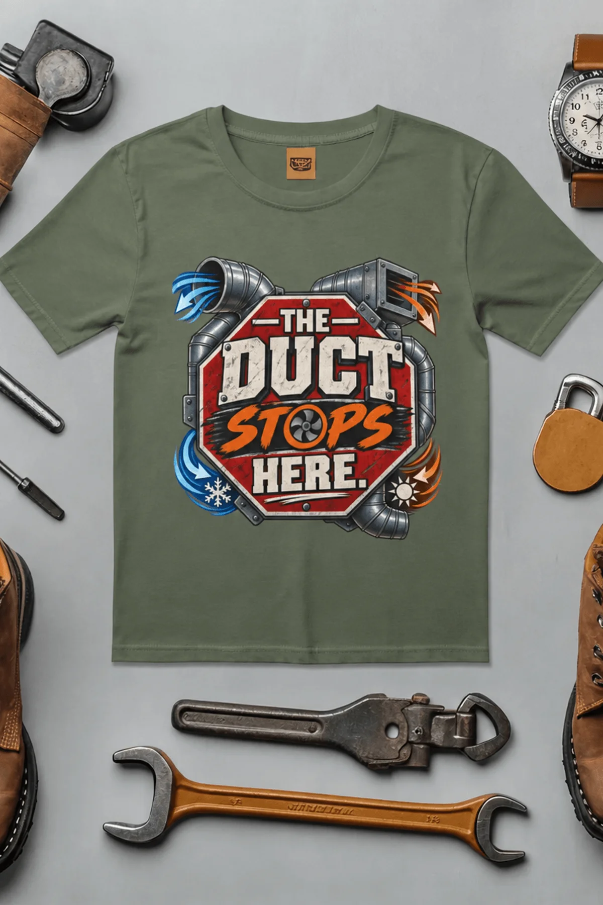 The Duct Stops Here T-Shirt — HVAC Technician Funny Logo Tee — moss t-shirt, flat-lay product photo | Pressure Tested Co